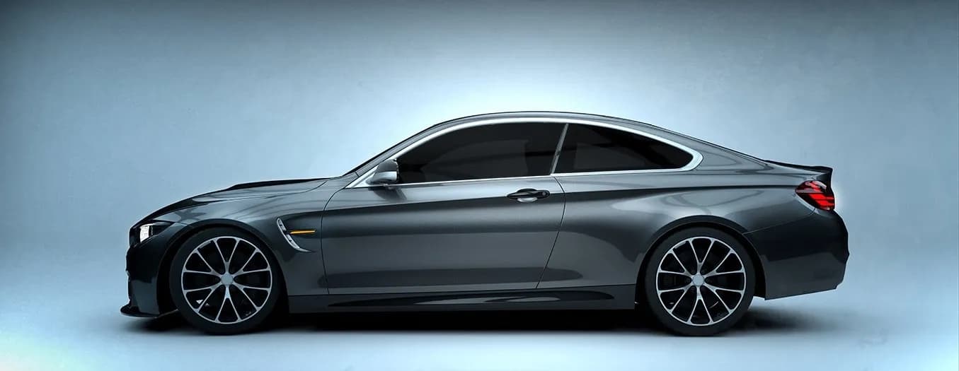 Limo window tint on a grey coupe, side view