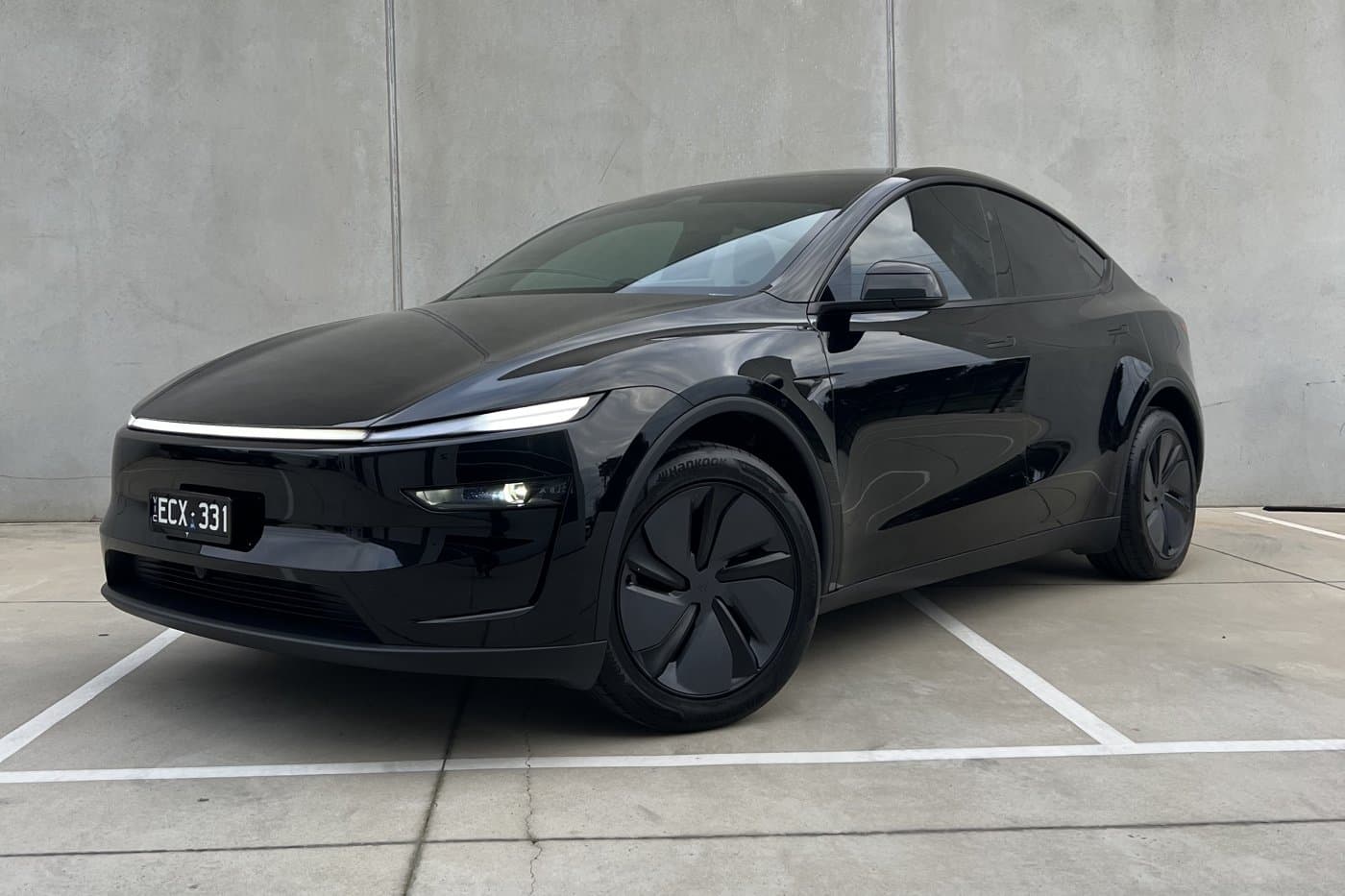 Black Tesla Model Y detailed on site