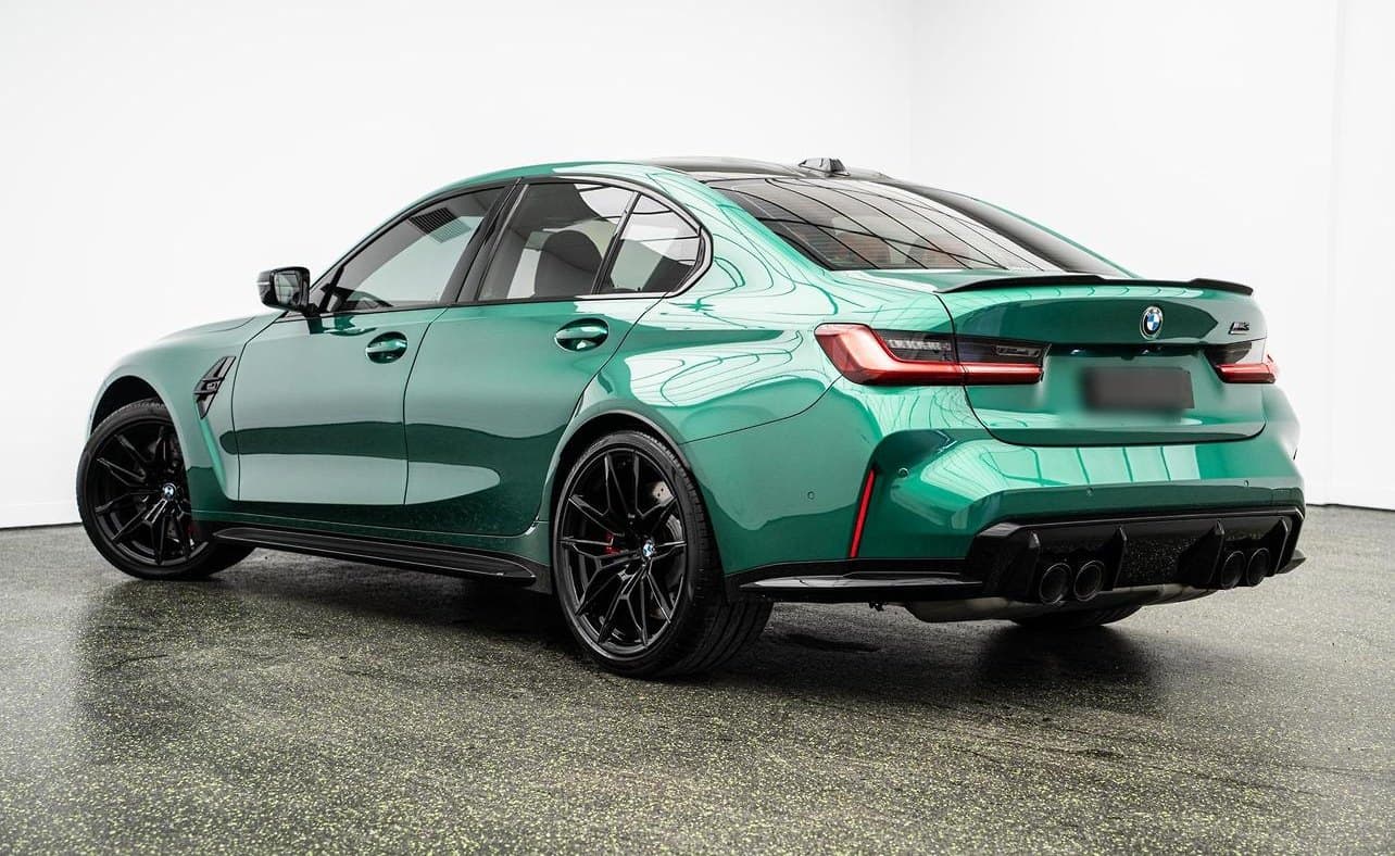 Green BMW M3 in a photo studio