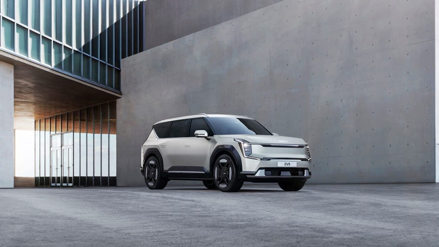 Kia EV9 parked outside a modern building