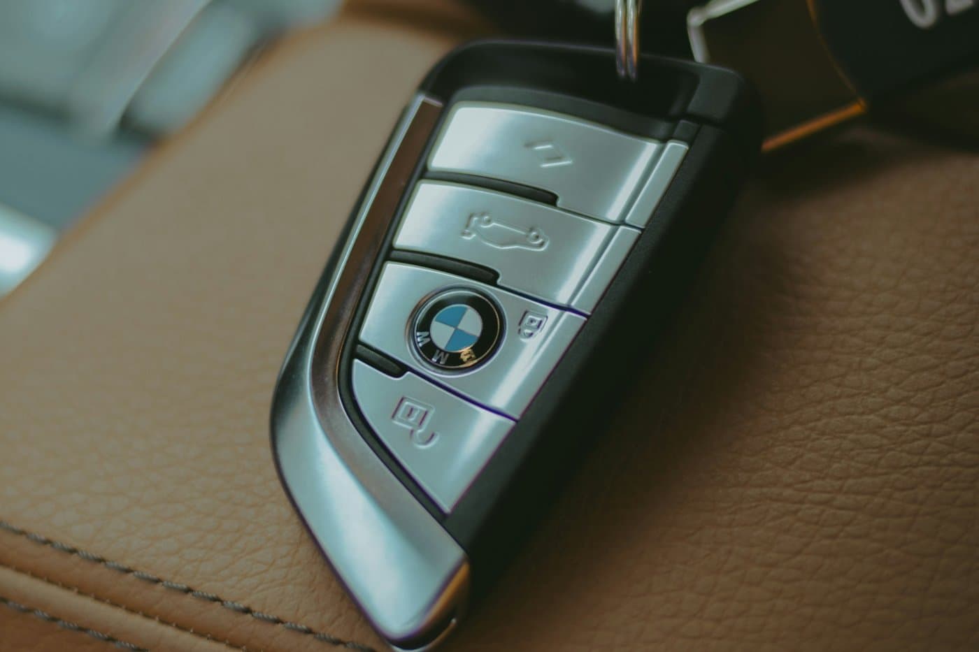 Two BMW smart keys on leather seats