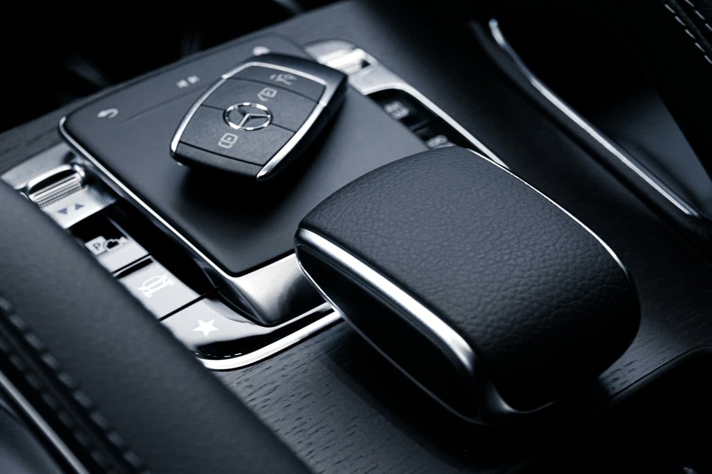 Mercedes smart key on a dark console