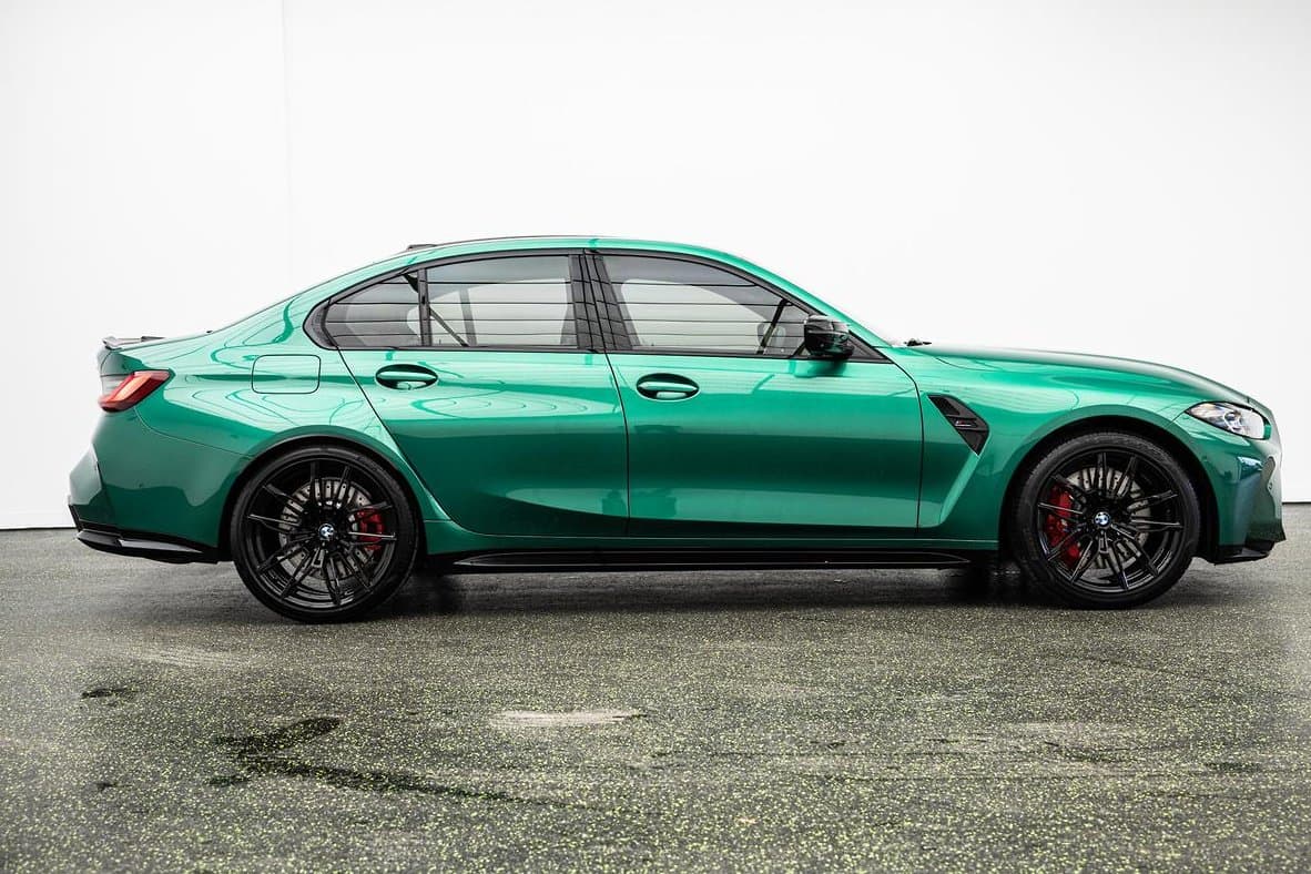 Green BMW M3 side profile photographed for sale