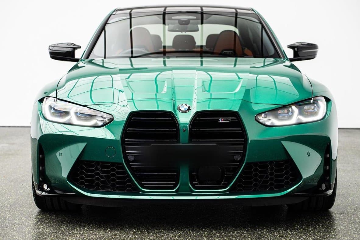 Front of a green BMW M3 photographed for sale