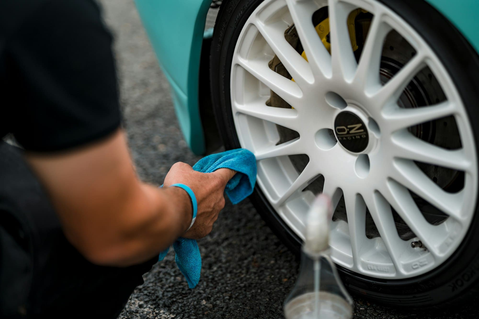 Alloy wheel being cleaned with a microfibre towel
