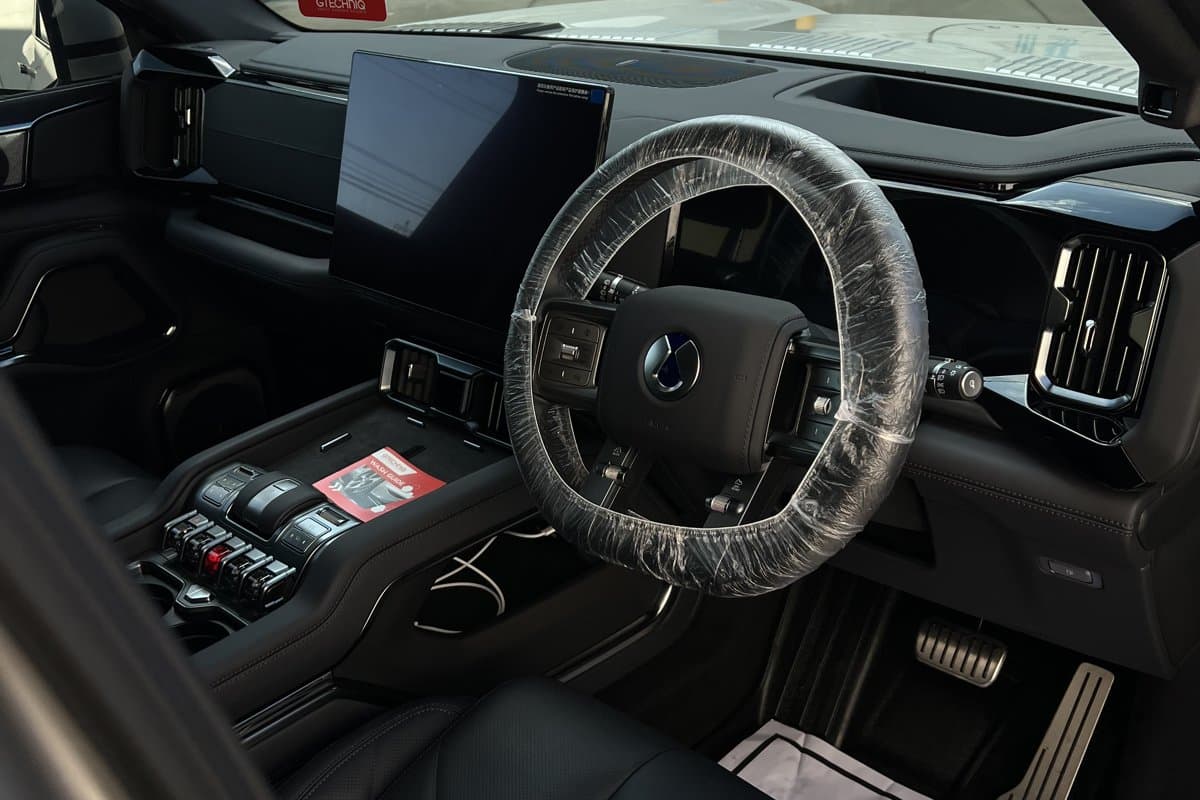 Car interior being detailed with protective covers on
