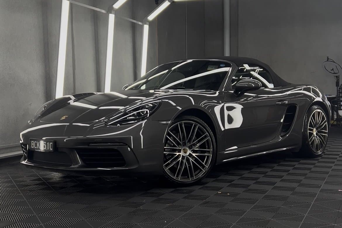Porsche 718 under paint inspection lights