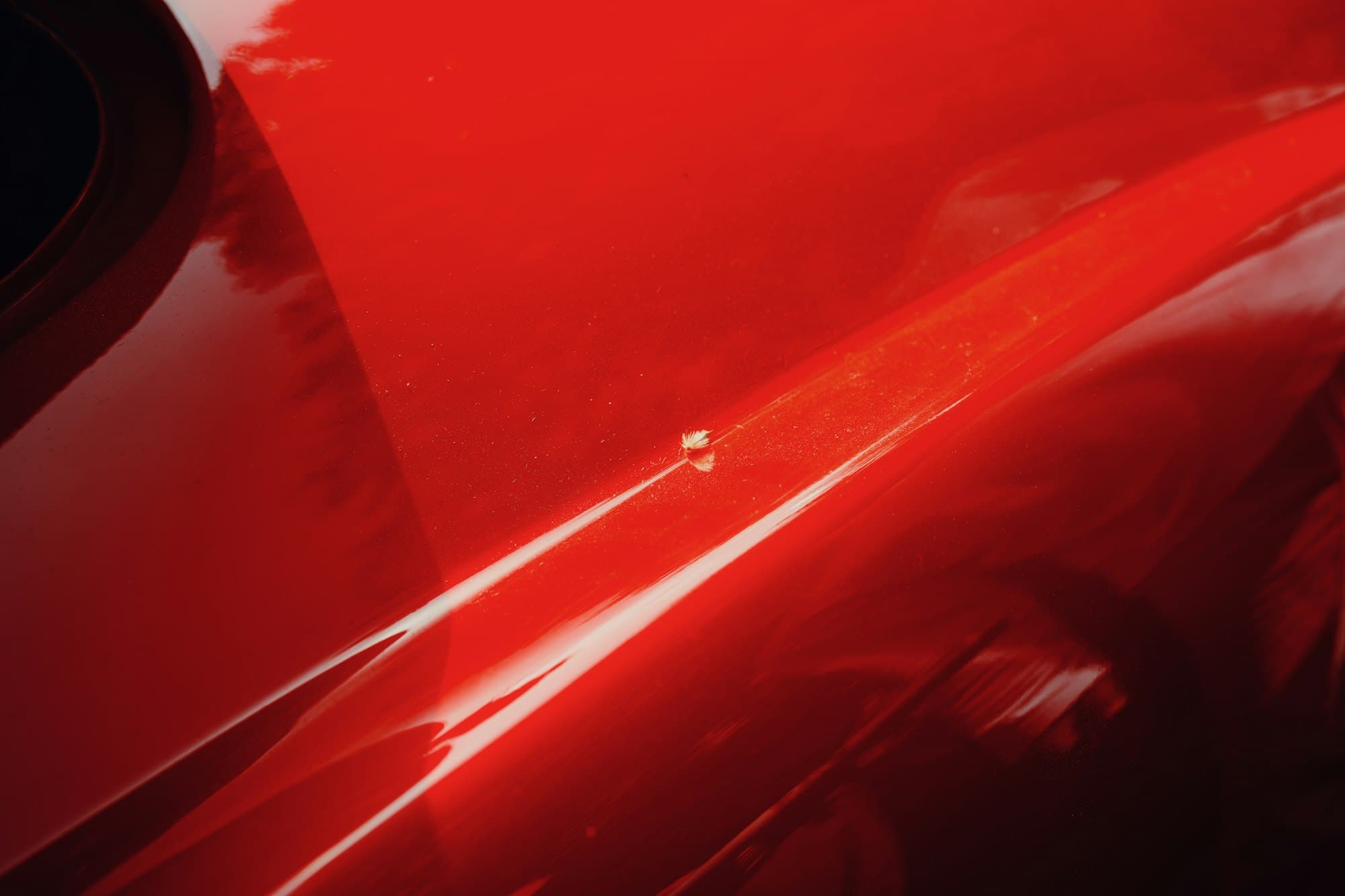 Close-up of glossy red car paint