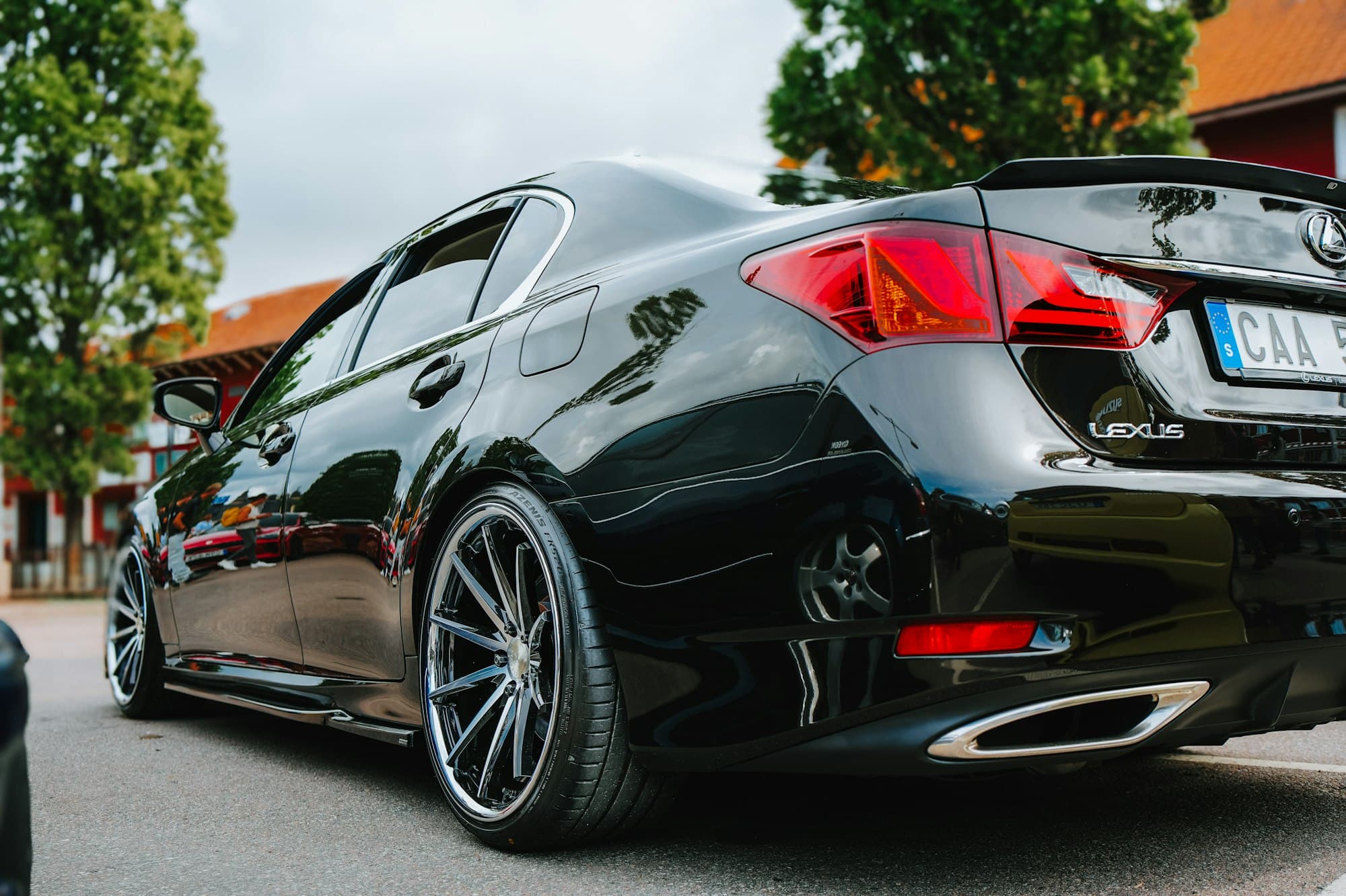 Glossy black sedan with a freshly detailed finish