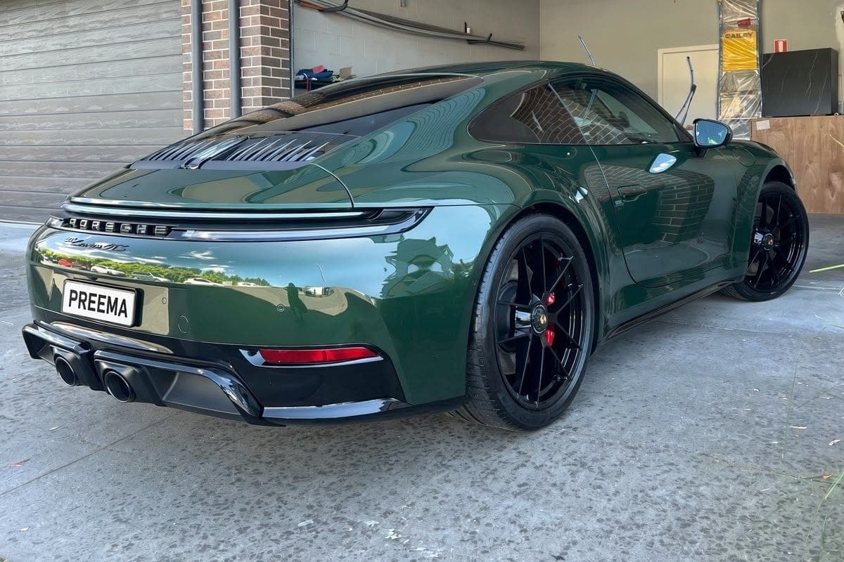 Green Porsche 911 with a deep, glossy ceramic coated finish