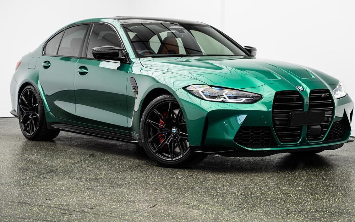 Green BMW M3 photographed for sale after a pre-sale detail