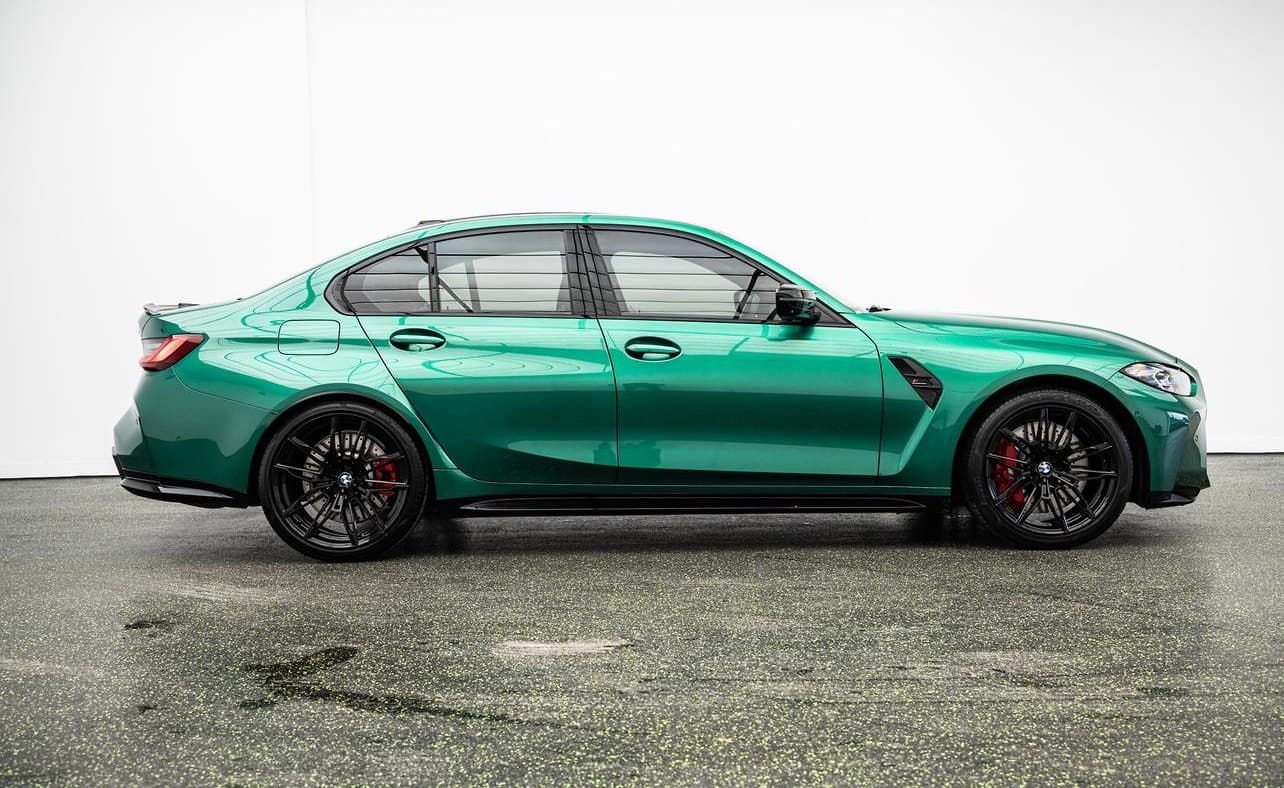 Green BMW M3 photographed for sale after a pre-sale detail