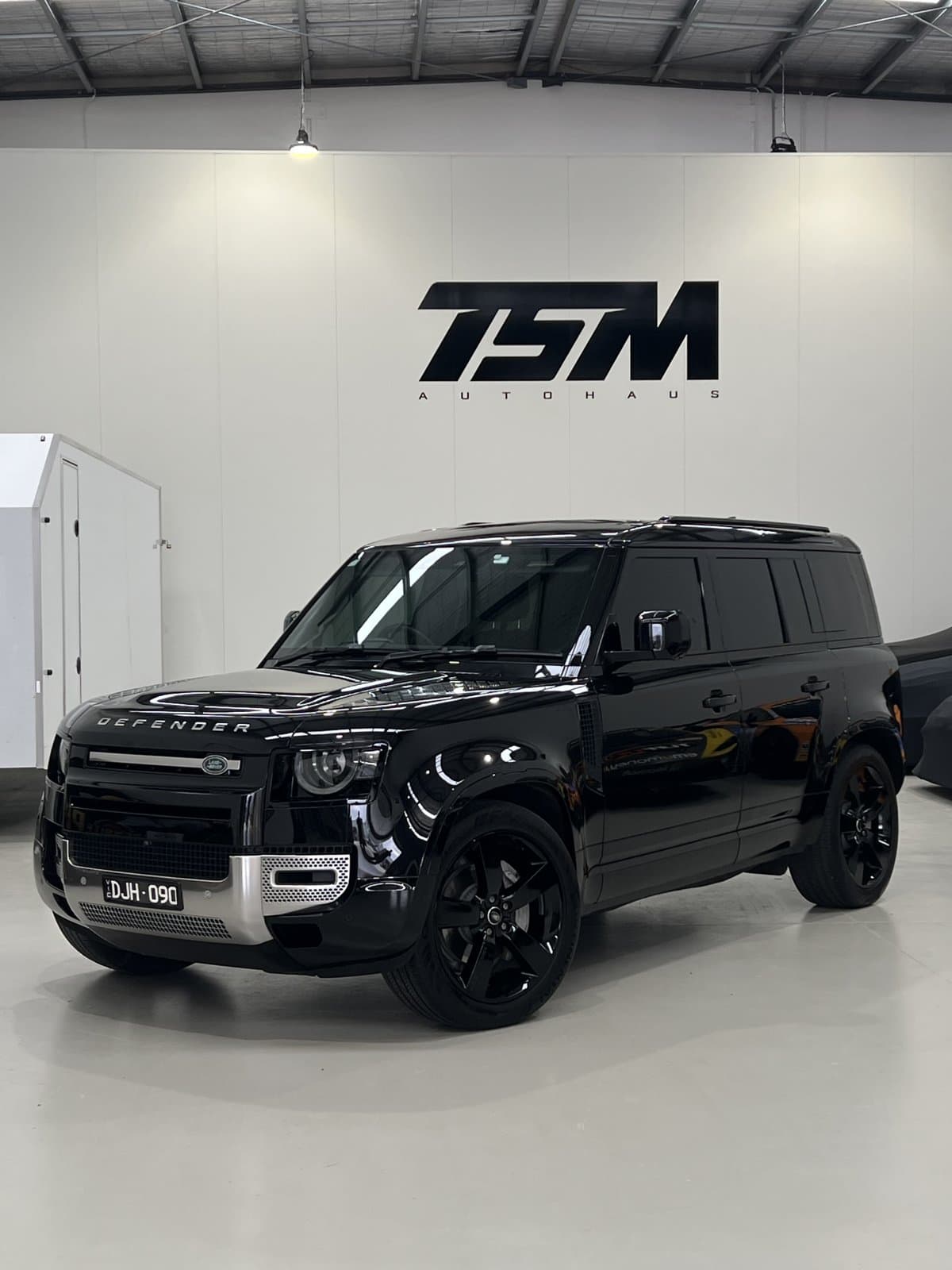 Black Land Rover Defender after a detail