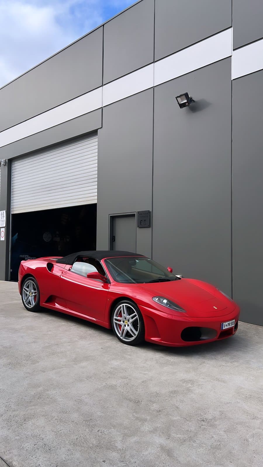 Red Ferrari F430 Spider after a paint enhancement